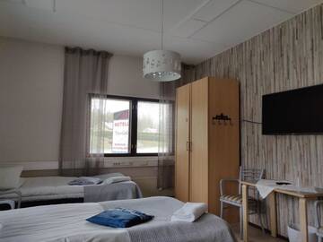 Фото номера Трехместный номер эконом-класса с общей ванной комнатой Отель Hotel Vuolake г. Лаукаа 6