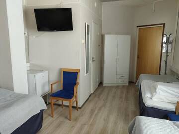 Фото номера Стандартный трехместный номер Отель Hotel Vuolake г. Лаукаа 4
